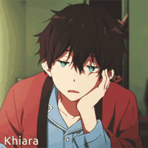 a boy rapidly blinking with a tired and confused look on his face.